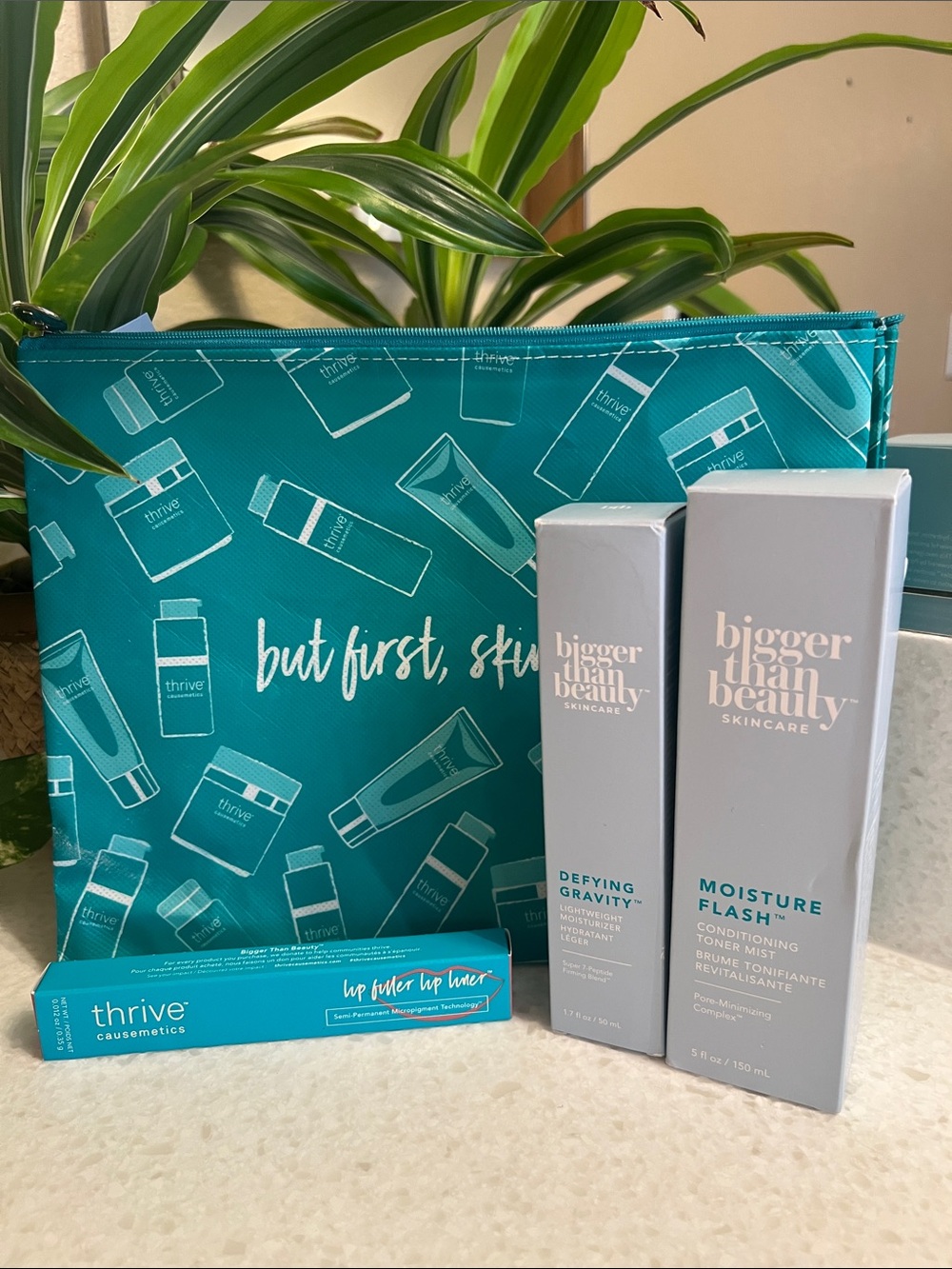 thrive causemetics Teal Cosmetic Pouch with Skincare Trio